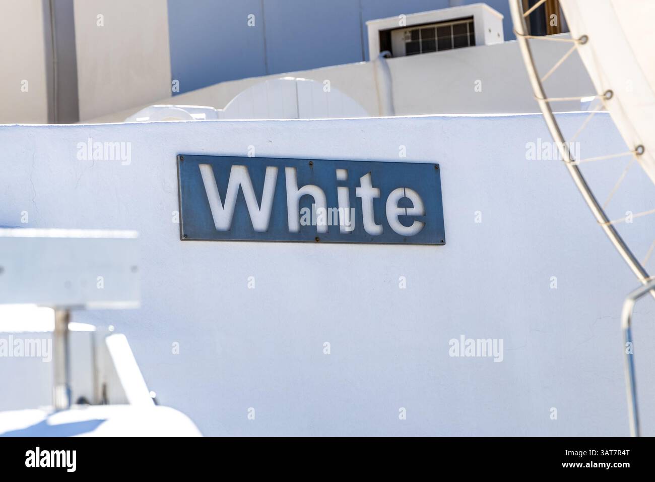 Blue hotel sign reading White on white wall in Imerovigli Santorini ...