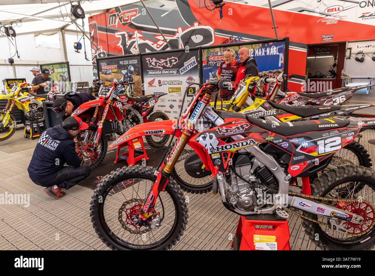 October Busy Work Winchester, UK- October 5, 2024: KMP Honda Racing pit with multiple red ...