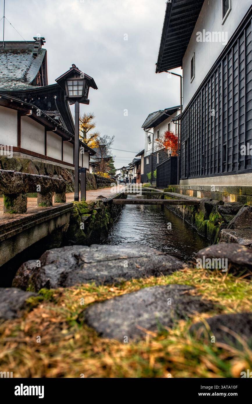 Narrow waterway through the old town on an overcast day, Hida Furukawa, Gifu, Honshu, Japan Stock Photo