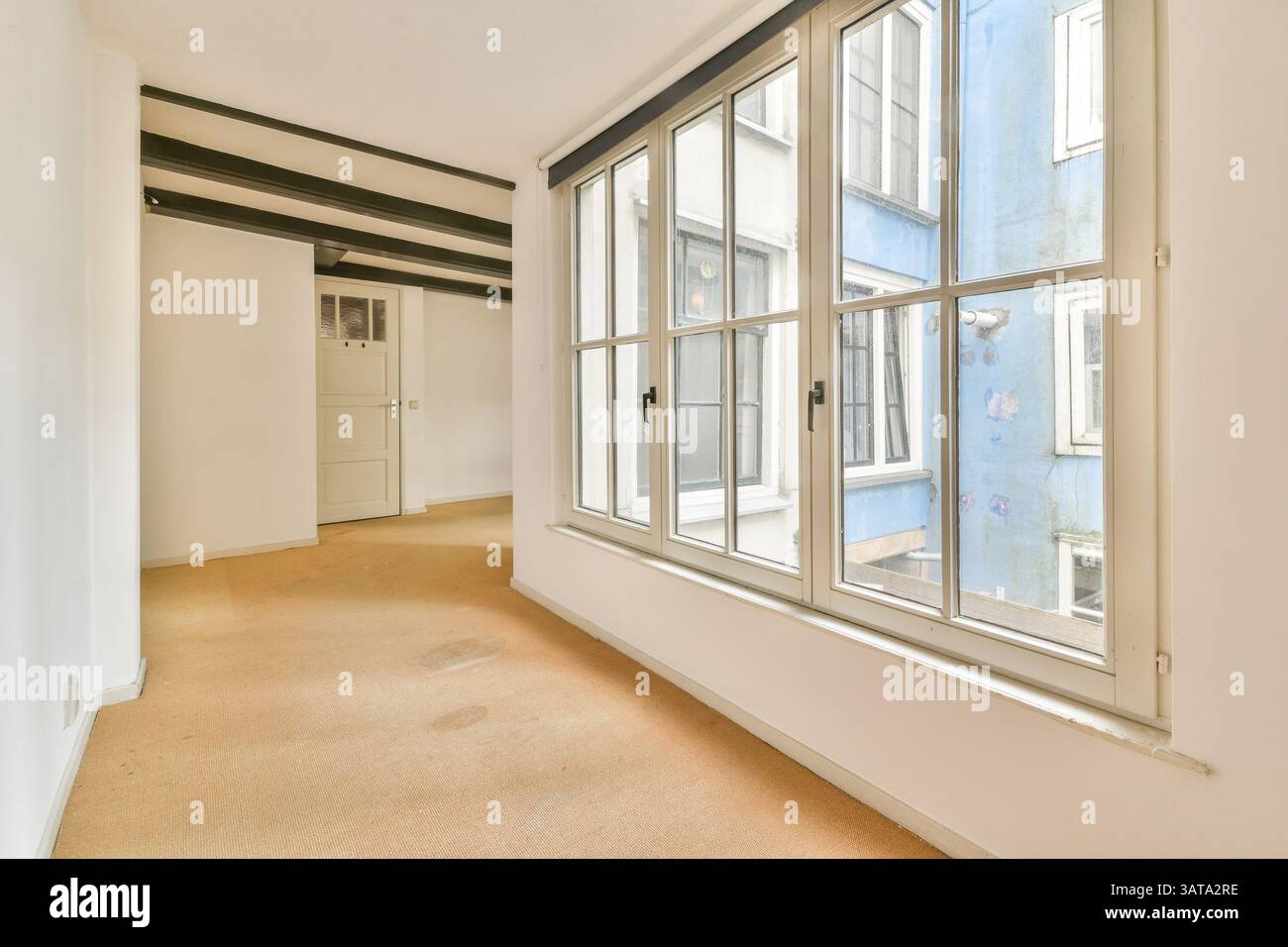 Bright interior space featuring expansive windows that allow natural ...