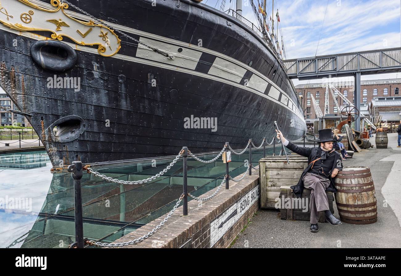 Actor dressed as Isambard Kingdom Brunel sat on vintage boxs pointing ...