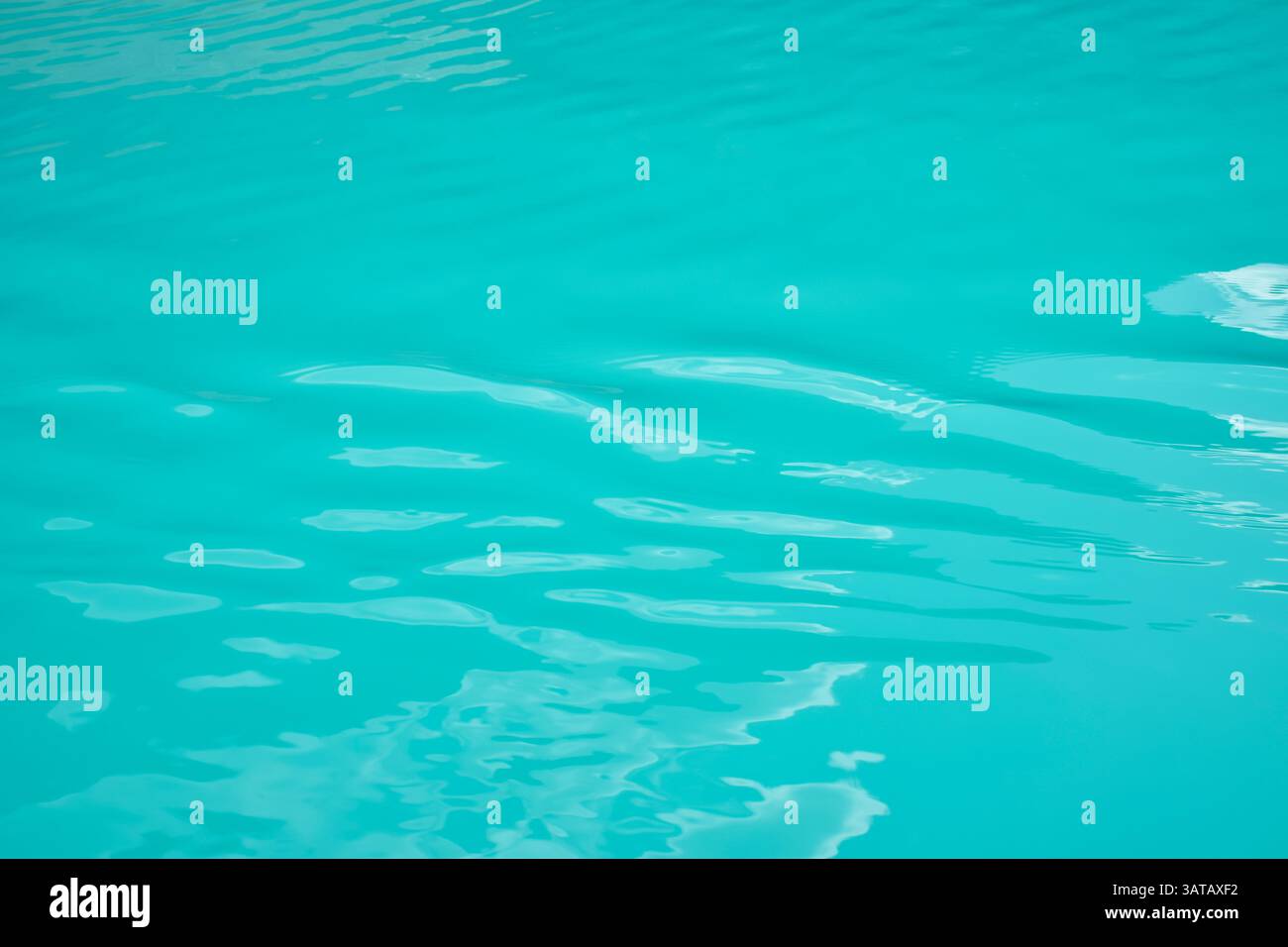 Turqouise blue lake water background Stock Photo