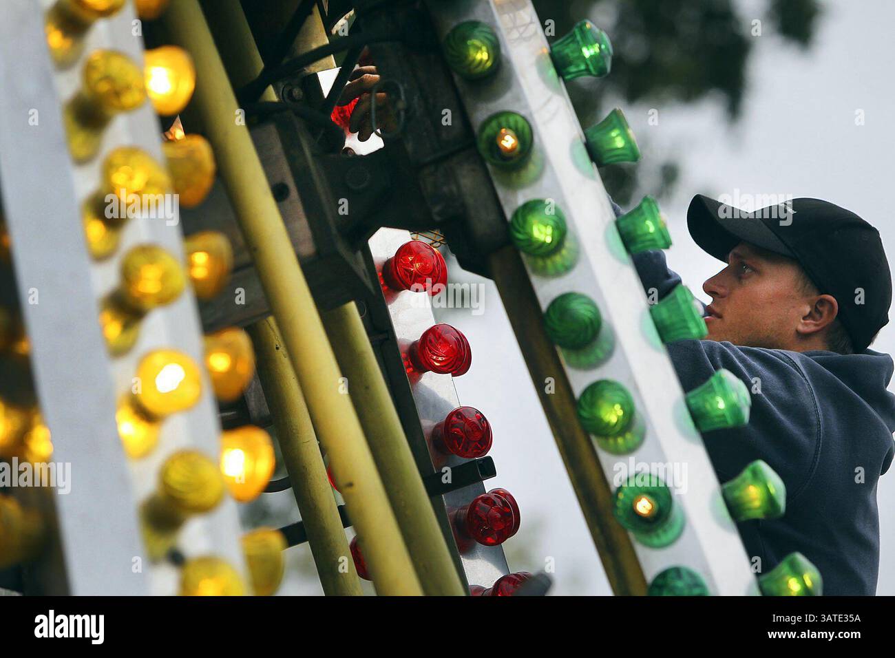 Oct. 8, 2013 - Columbia, SC, USA - Danie Schoonraad of South Africa, caps and replaces lights on the Safari Airport in Kiddie Land as fair workers do some last-minute prepping Tuesday morning, October 8, 2013, before opening day tomorrow at the South Carolina State Fair grounds in Columbia, South Carolina  (Credit Image: © Kim Kim Foster-Tobin/MCT/ZUMAPRESS.com) Stock Photo