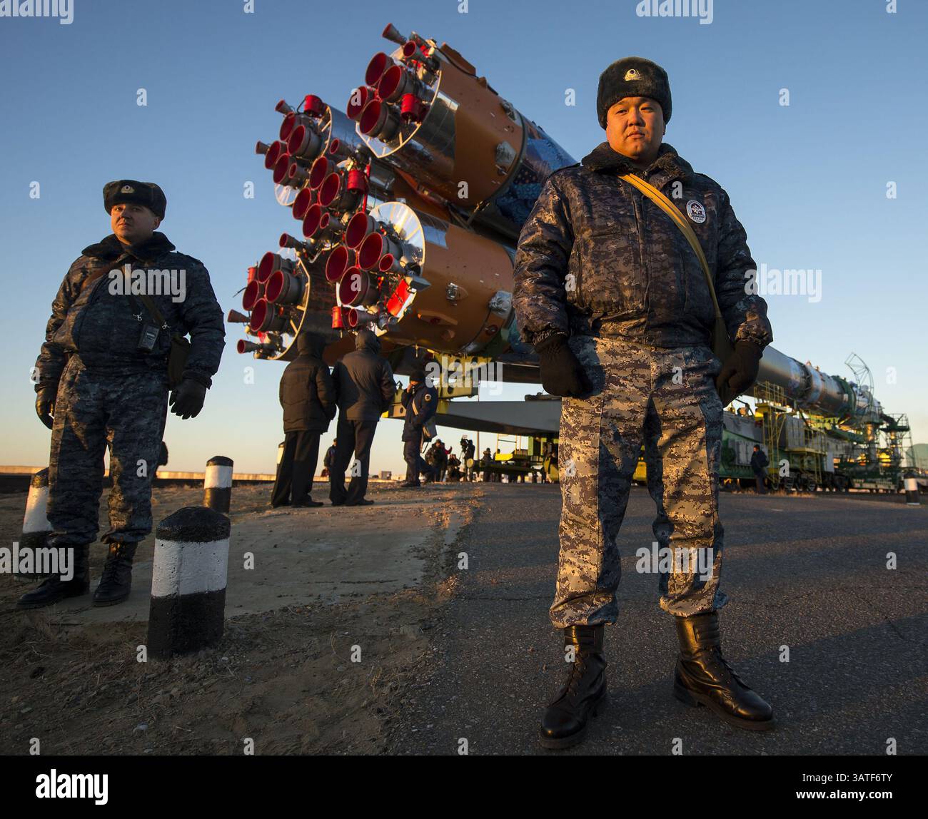 Nov. 5, 2013 - Baikonur, Kazakhstan - Security monitors the Soyuz TMA-11M rocket as it is rolled out to the launch pad by train at the Baikonur Cosmodrome in Kazakhstan. Launch of the Soyuz rocket is scheduled for November 7 and will send Expedition 38 Soyuz Commander Mikhail Tyurin of Roscosmos, Flight Engineer Rick Mastracchio of NASA and Flight Engineer Koichi Wakata of the Japan Aerospace Exploration Agency on a six-month mission aboard the International Space Station. (Credit Image: © Prensa Internacional/ZUMAPRESS.com) Stock Photo