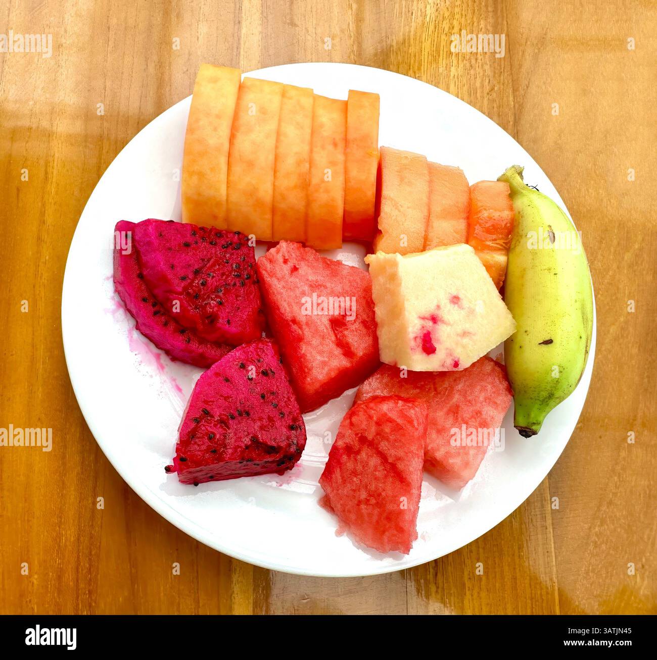 Plate of delicious tropical fruits Stock Photo