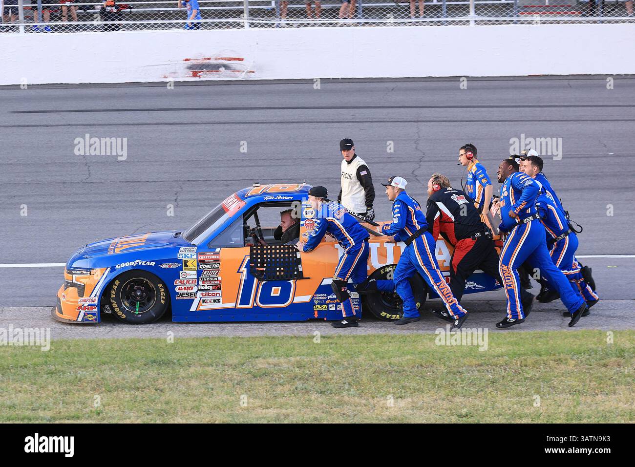 ROCKINGHAM, NC - APRIL 18: The #18 teams pushes Tyler Ankrum (#18 ...