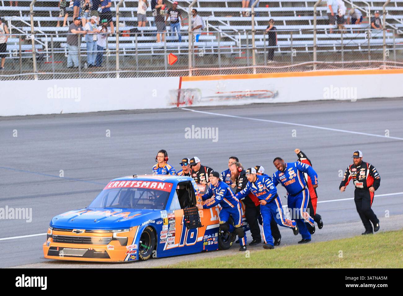 ROCKINGHAM, NC - APRIL 18: The #18 teams pushes Tyler Ankrum (#18 ...