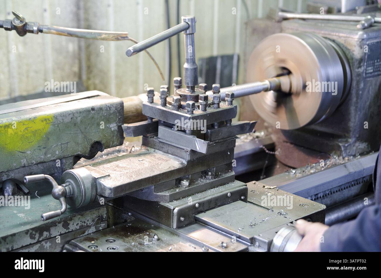 An operator works at a metal working machine Stock Photo
