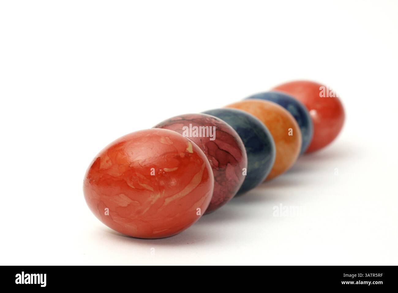 6 Easter eggs - Six colourful eggs arranged on a white background Stock Photo