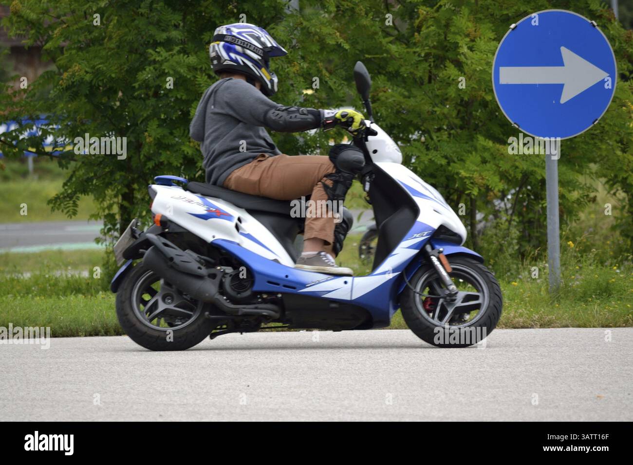 Moped riding technique training on the practice area Stock Photo - Alamy