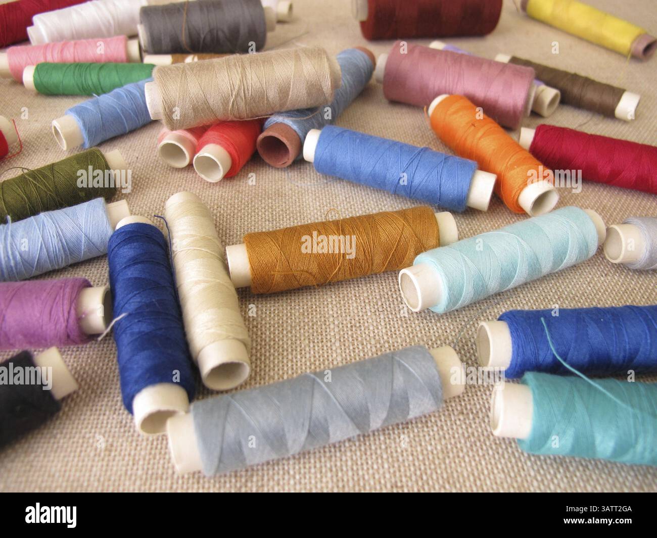 Sewing thread in different colours Stock Photo