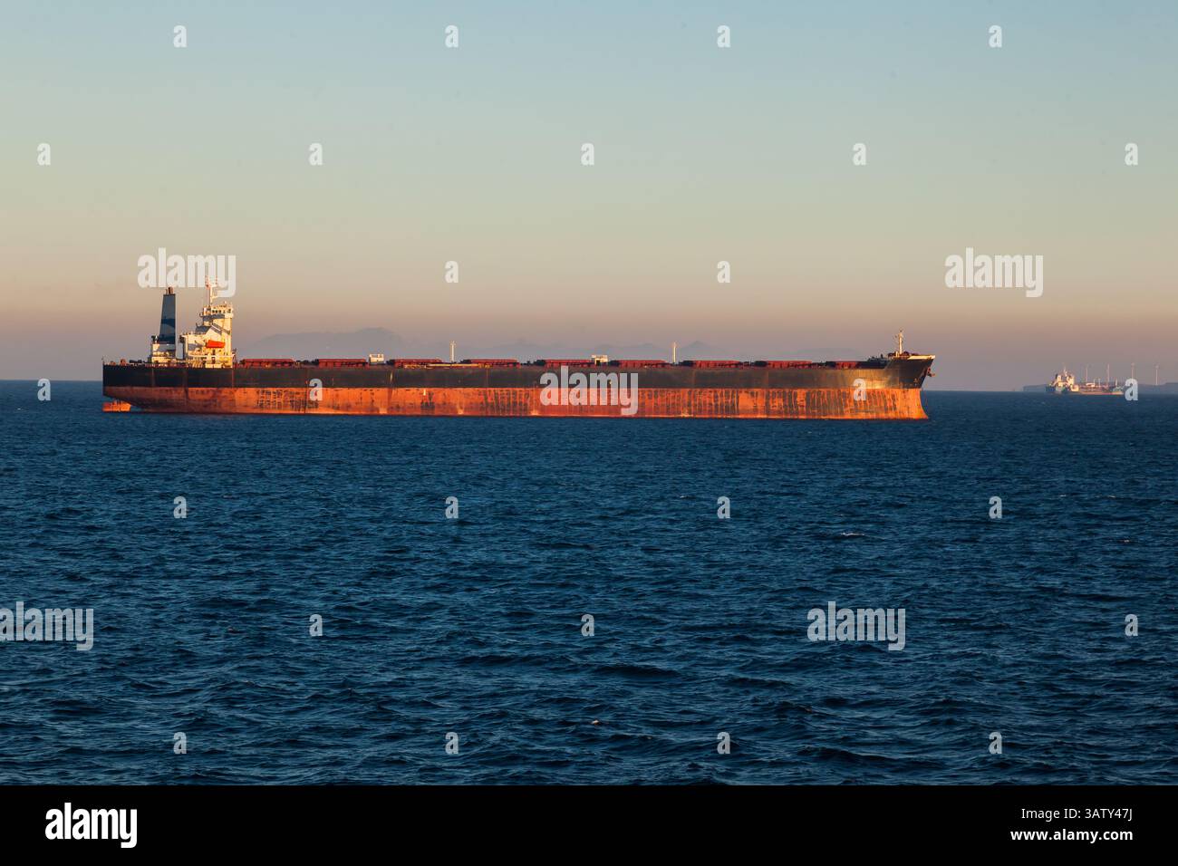 Bulk cargo ships are anchored in the bay of the seaport of Fos-sur-Mer ...