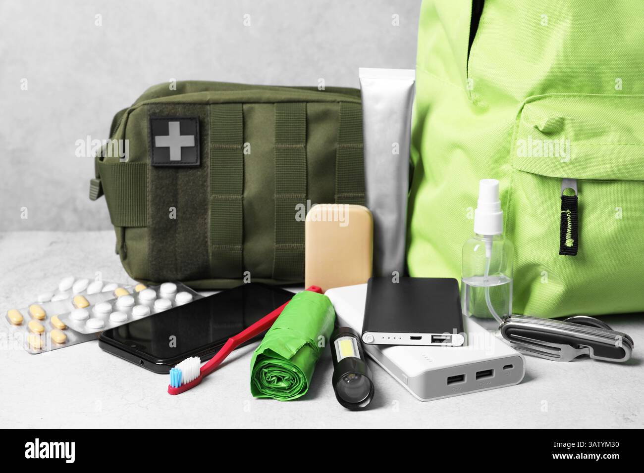 Survival kit. Different emergency supplies on light table Stock Photo