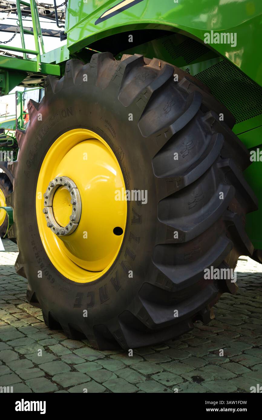 Combine With Rear Casters Large John Deere agricultural combine harvester, featuring robust rear ...