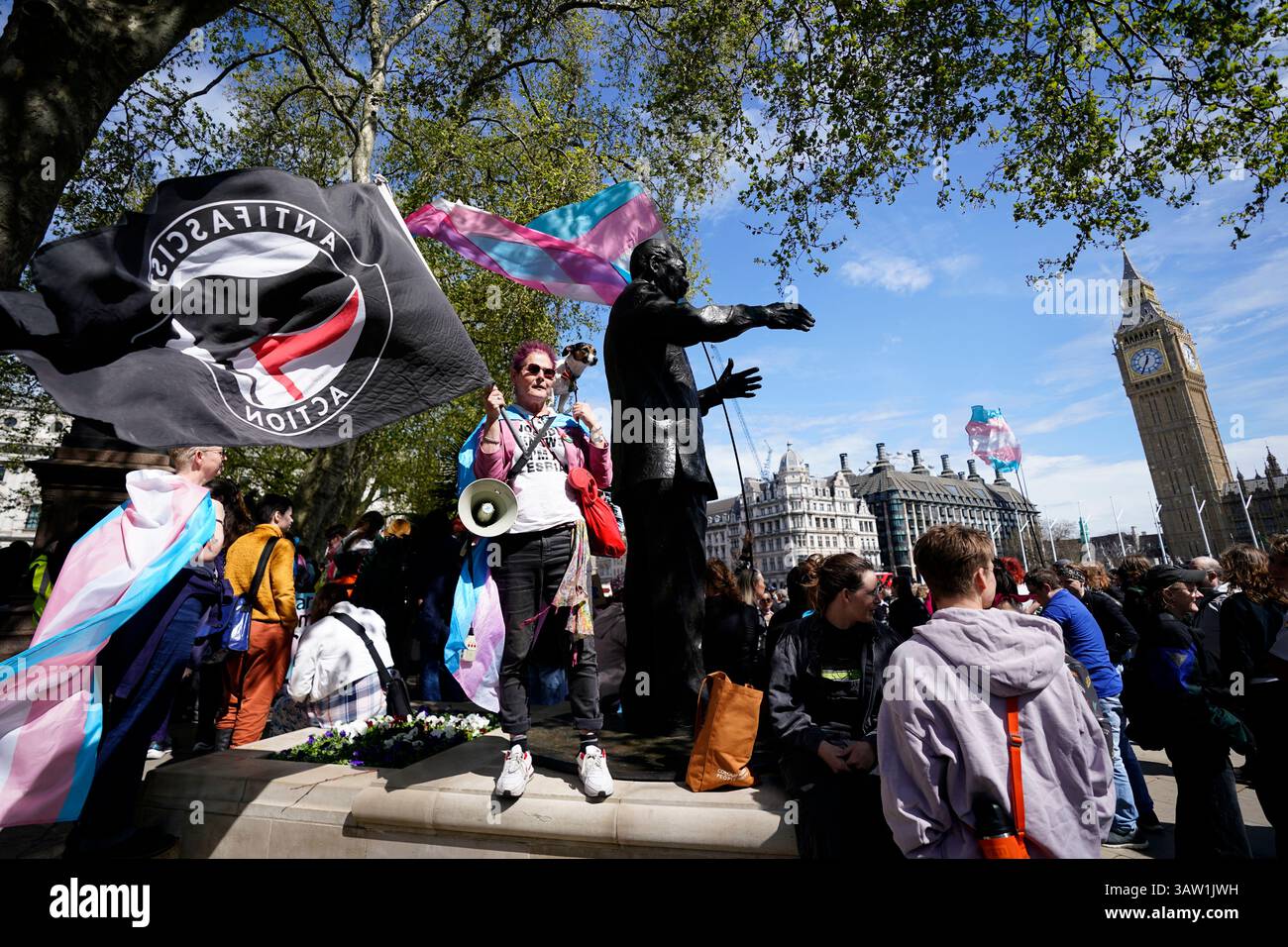Campaigners take part in a rally organised by trans rights groups ...