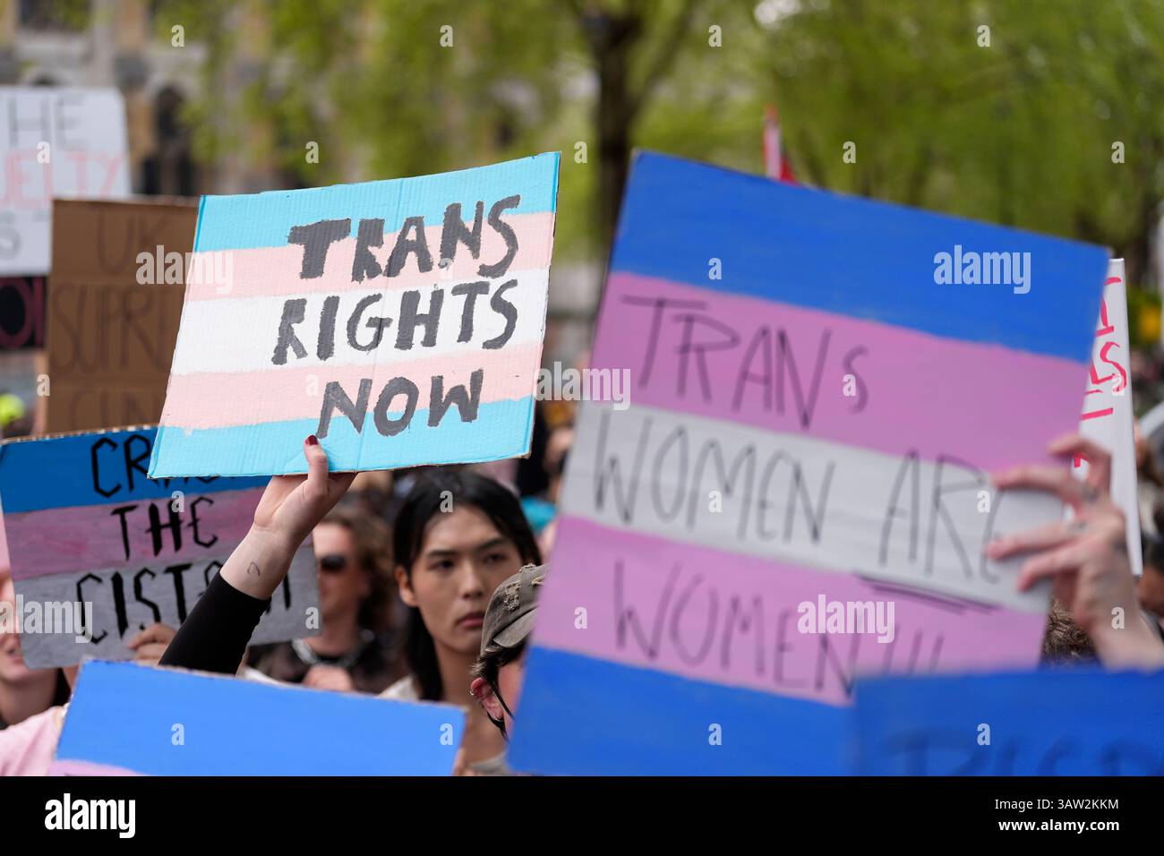 Campaigners take part in a rally organised by trans rights groups ...