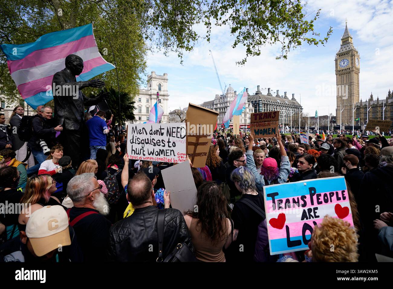Campaigners take part in a rally organised by trans rights groups ...