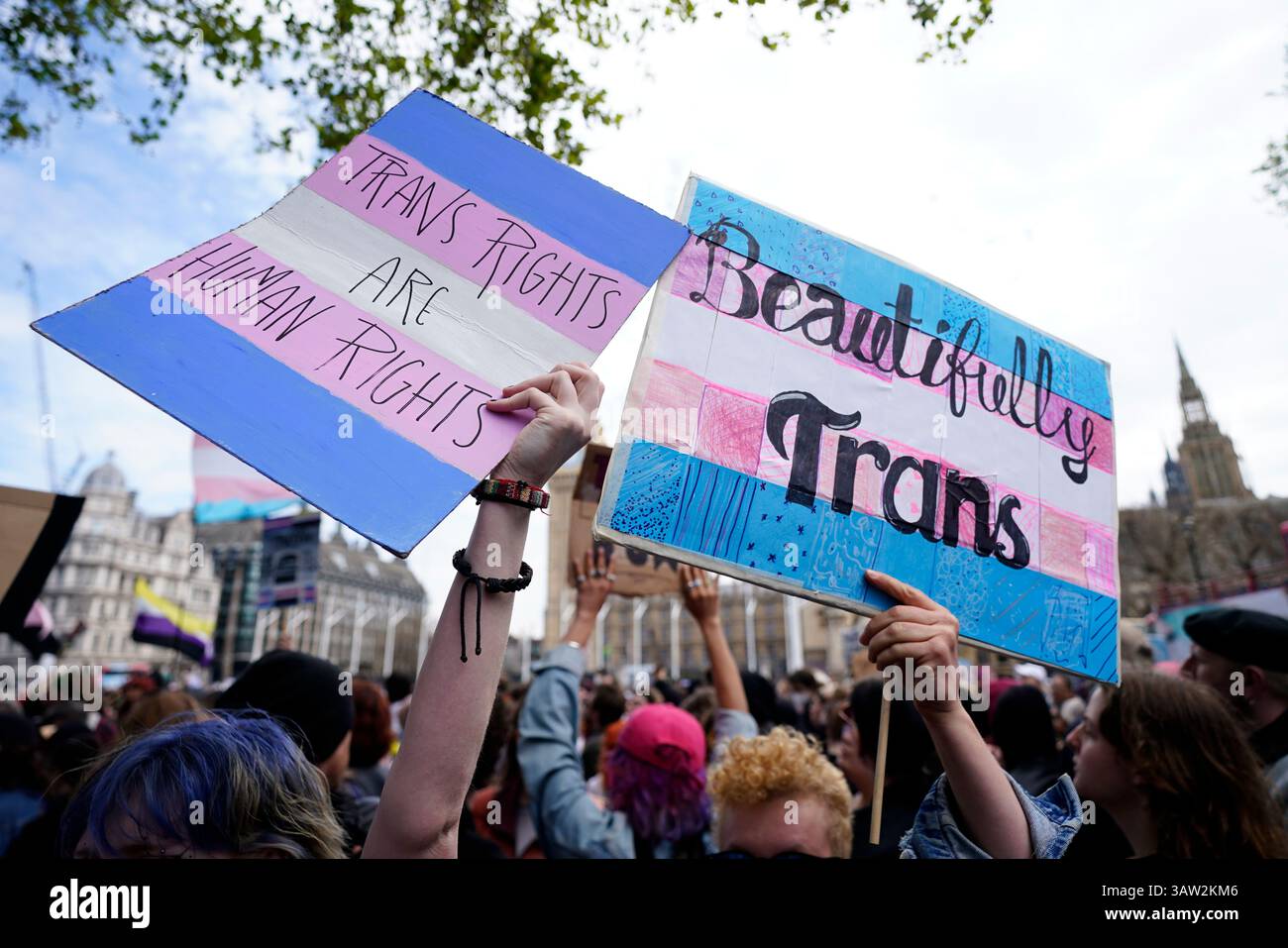 Campaigners take part in a rally organised by trans rights groups ...