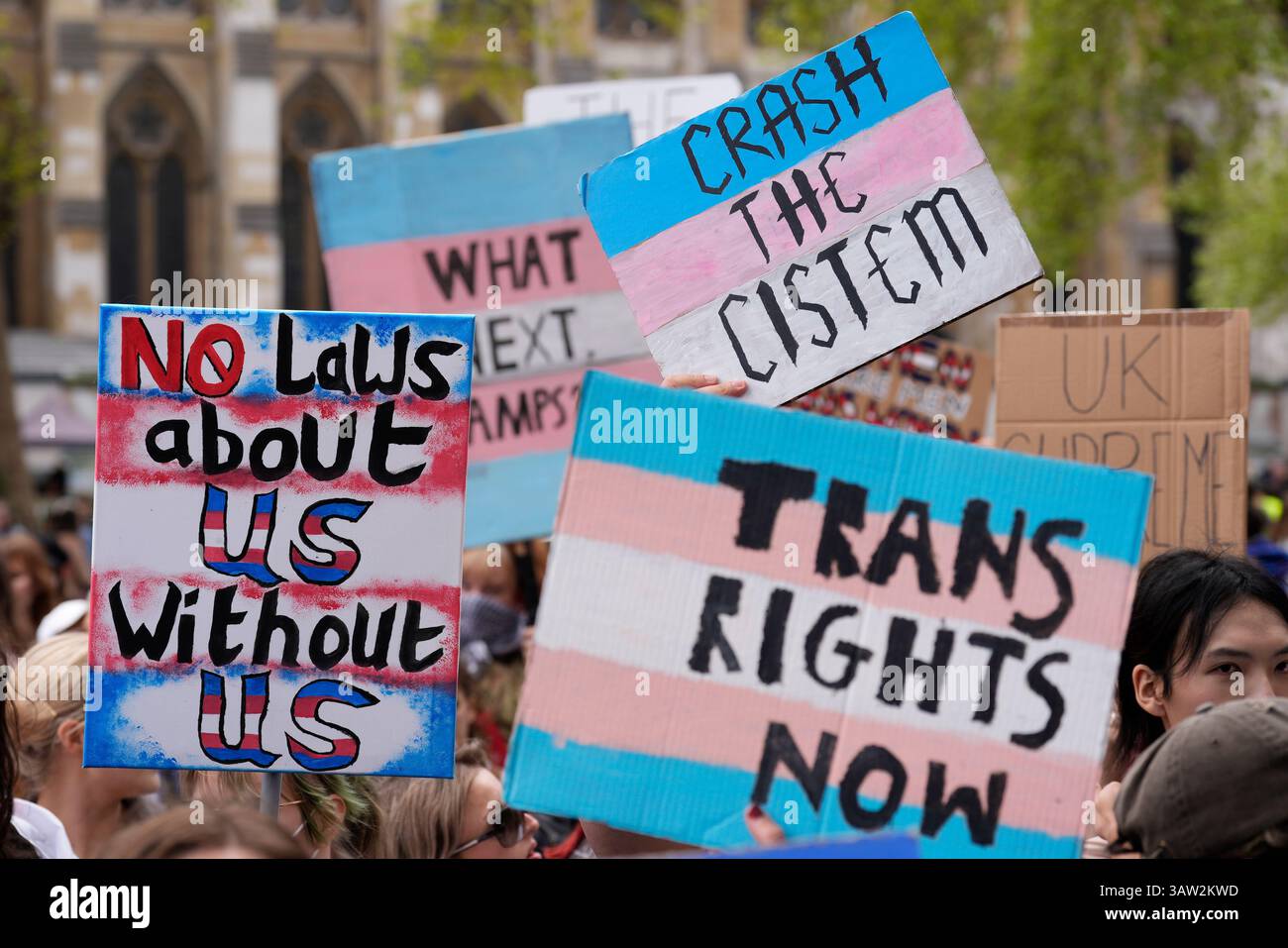 Campaigners take part in a rally organised by trans rights groups ...