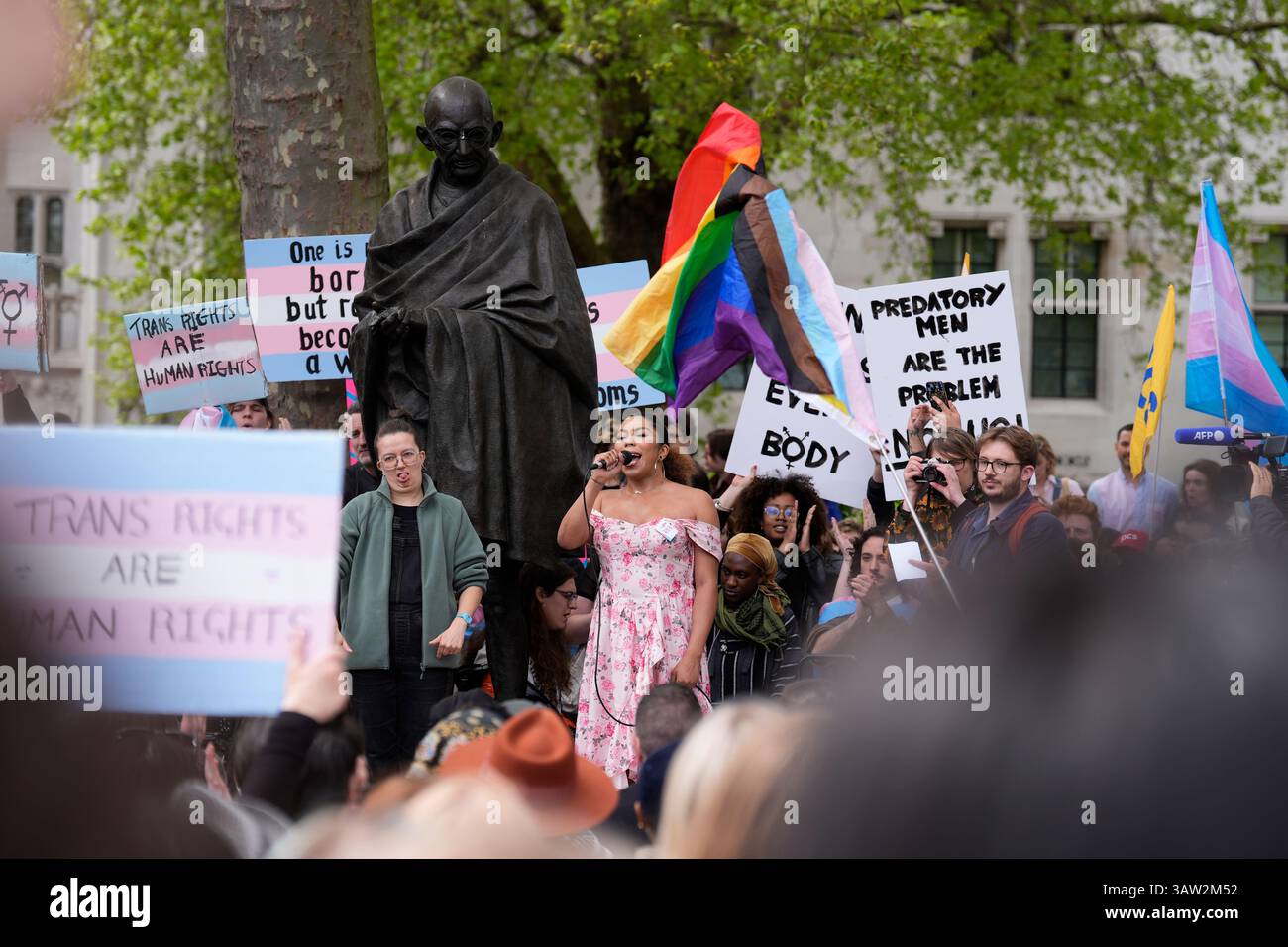 Campaigners take part in a rally organised by trans rights groups ...