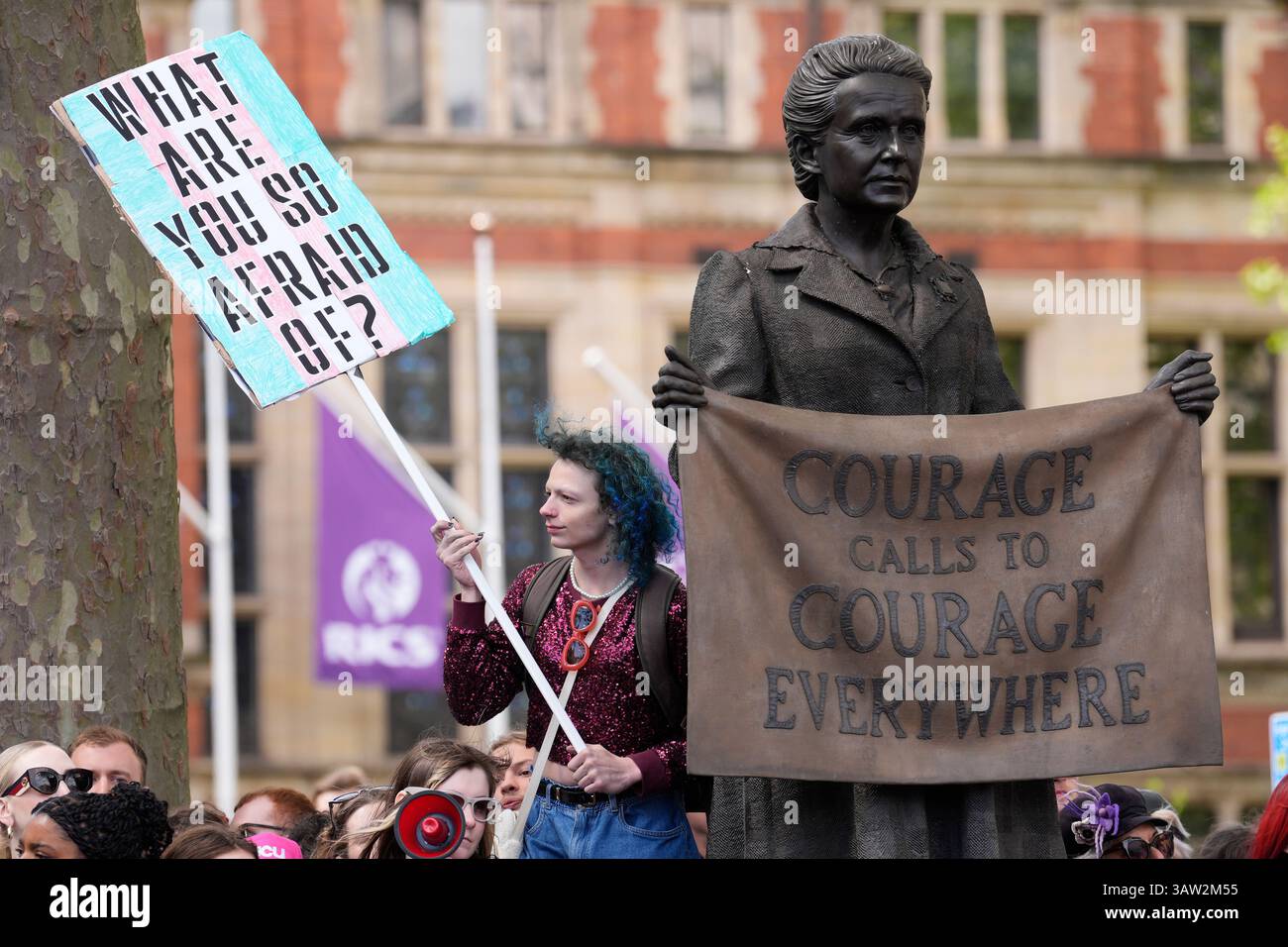 Campaigners take part in a rally organised by trans rights groups ...