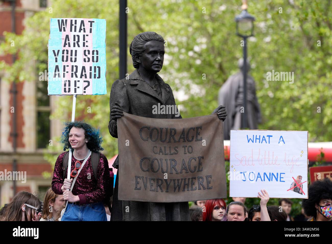 Campaigners take part in a rally organised by trans rights groups ...