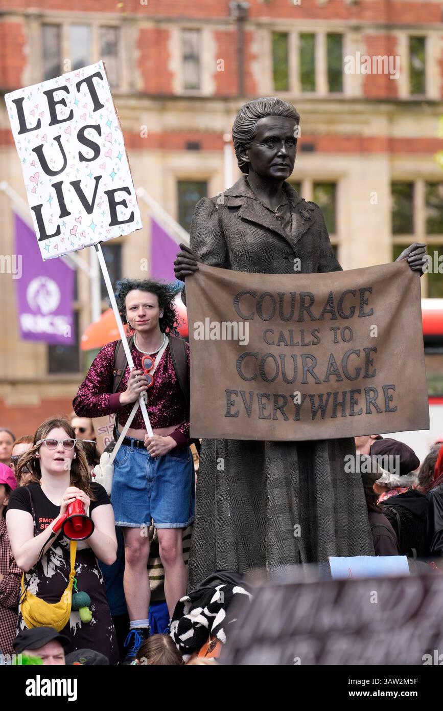 Campaigners take part in a rally organised by trans rights groups ...