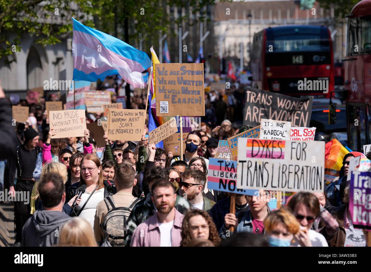 Campaigners take part in a rally organised by trans rights groups ...