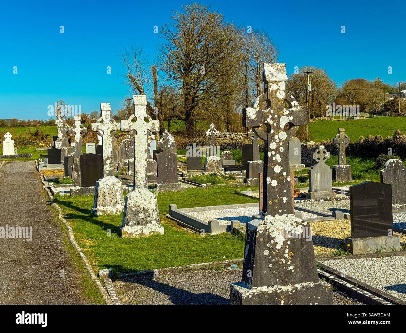 In a village graveyard in county Galway, Ireland, the typical gravestone is a stylised celtic cross - Smartphone Captured Stock Image