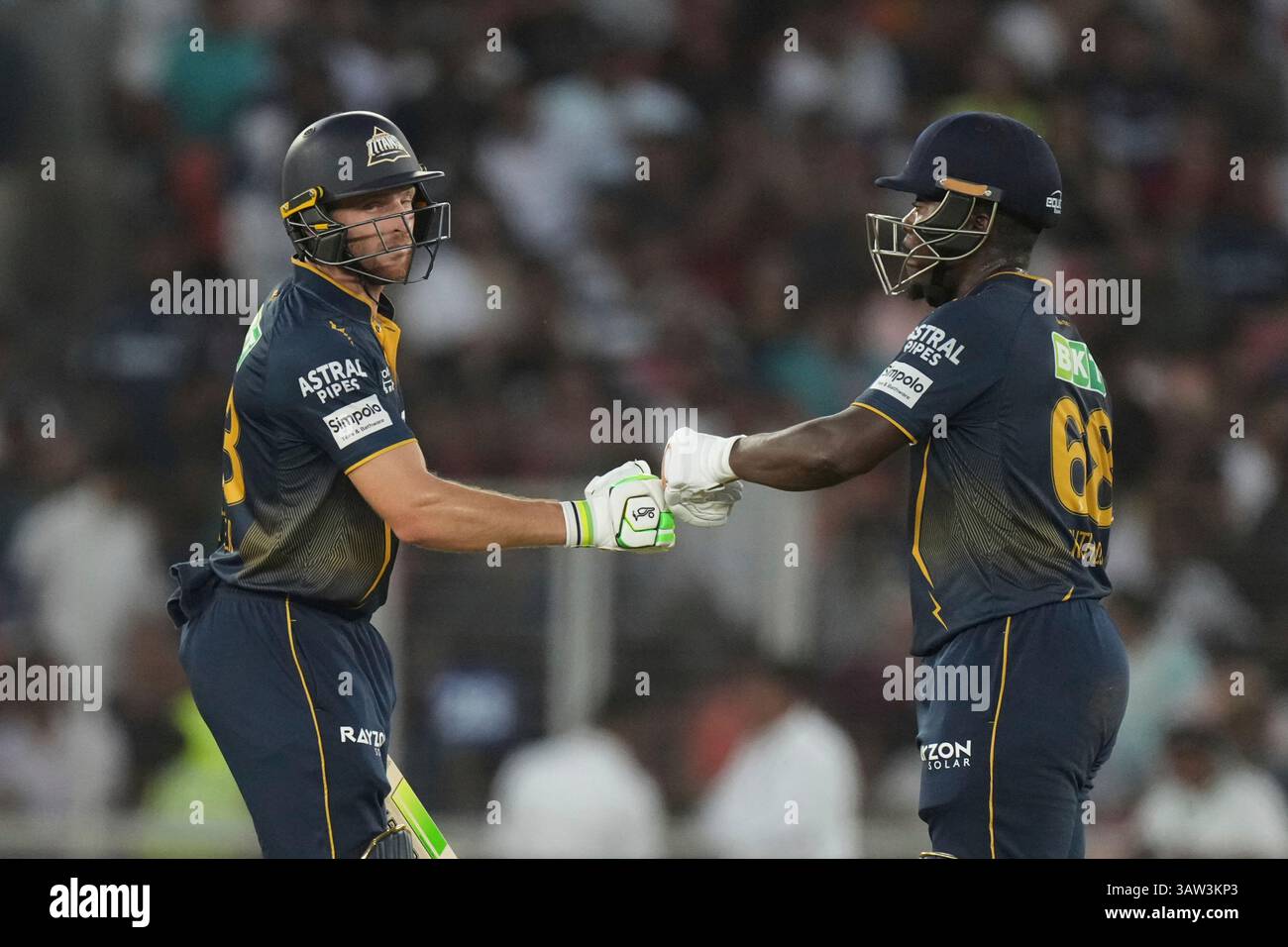 Gujarat Titans' Sherfane Rutherford and batting partner Jos Butler ...