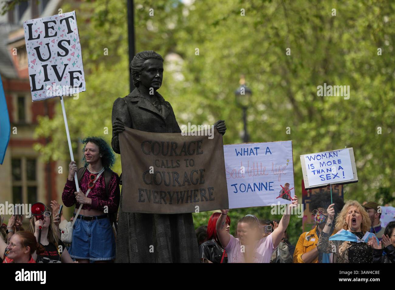 Campaigners take part in a rally organised by trans rights groups ...