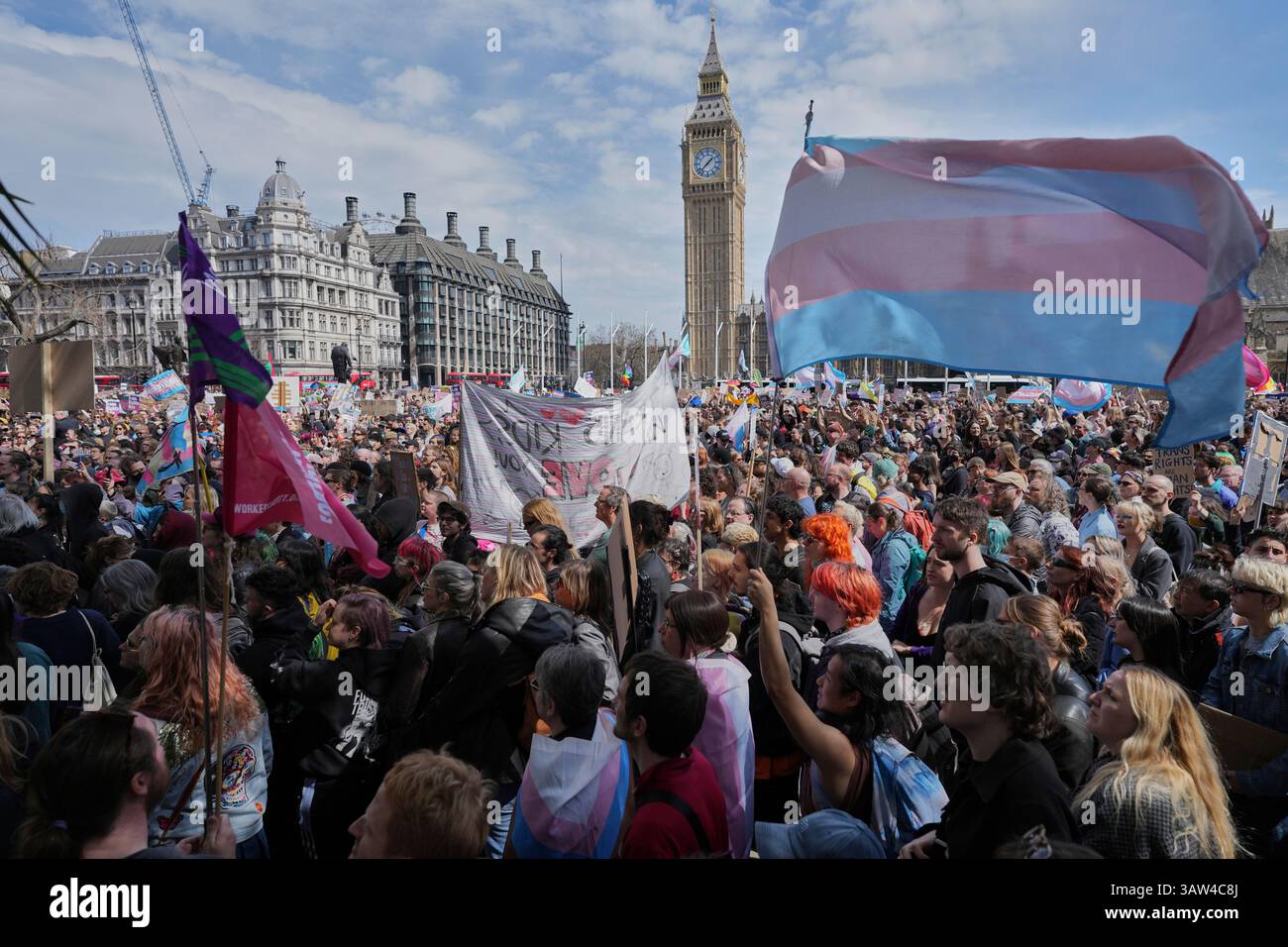 Campaigners take part in a rally organised by trans rights groups ...