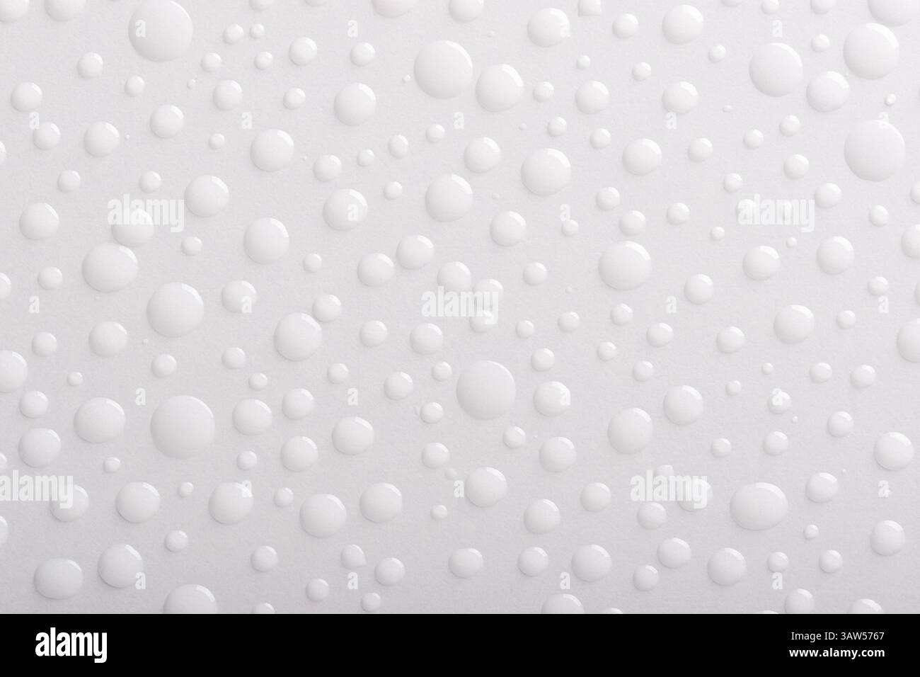 Close up water drops on white background. Top view. Stock Photo