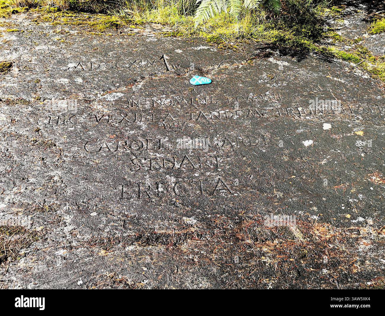 The real location where Bonnie Prince Charlie raised the Royal Standard during the 1745 rebellion in Glenfinnan. Latin engraved rock. - Smartphone Captured Stock Image