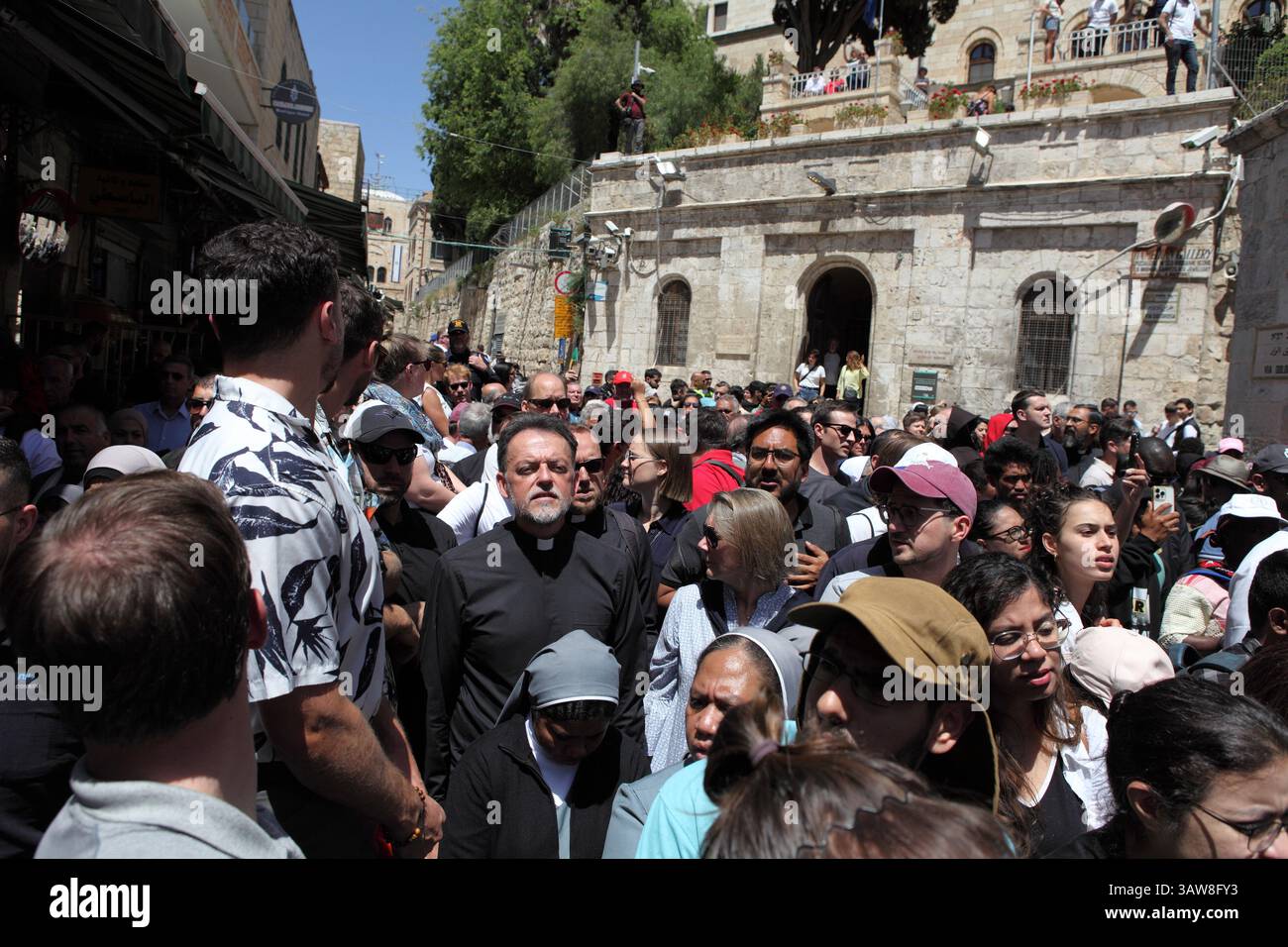 Crowd of Catholic pilgrims walk praying & singing in Good Friday ...