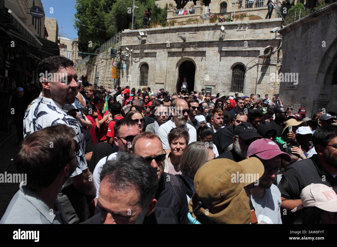 Crowd of Catholic pilgrims walk praying & singing in Good Friday ...
