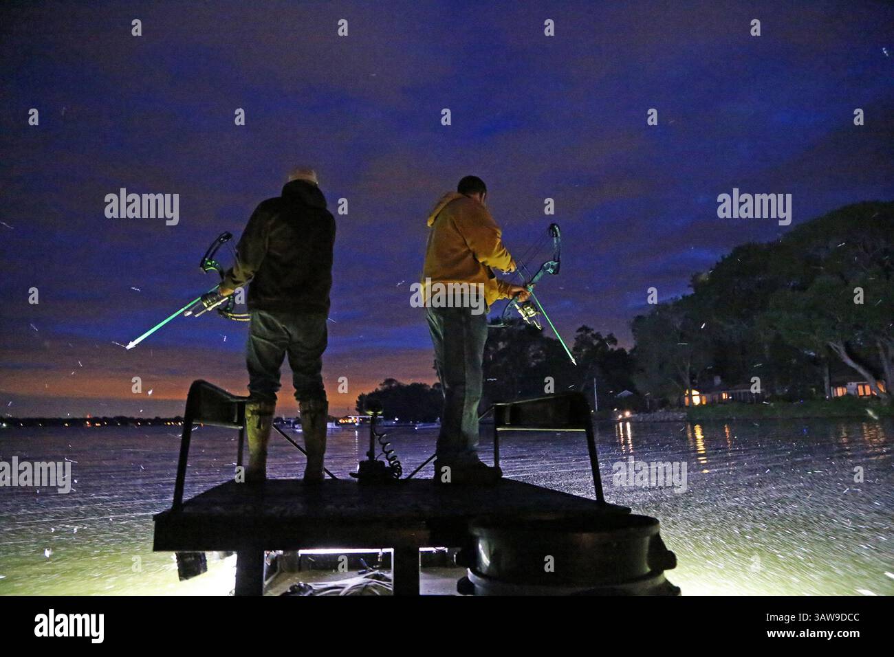 June 1, 2016 - Minneapolis, MN, USA - Amid a mayfly hatch, bowfishermen Vaghn Nelson, left, and Scott Stroyny, both of the Twin Cities area, patrol a metro lake looking for carp. (Credit Image: © Dennis Anderson/TNS via ZUMA Wire) Stock Photo