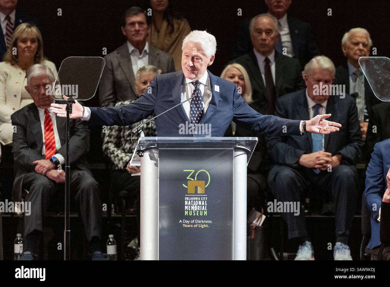 Former President Bill Clinton speaks to guest during the 30th