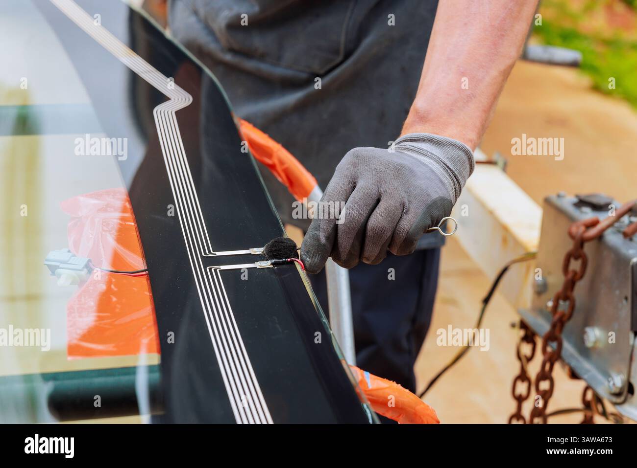 Technician worker carefully applies hi-res stock photography and images ...