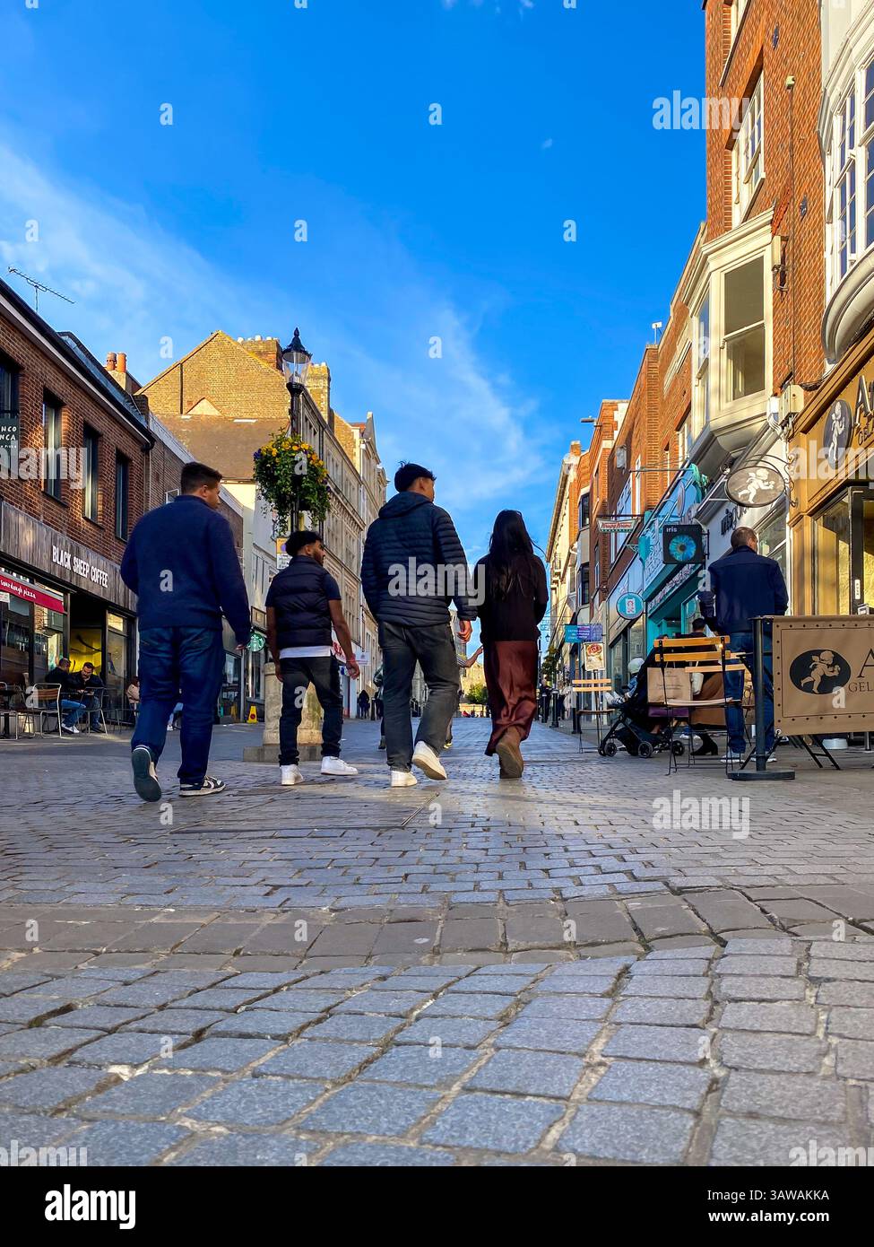 Low angle shot of people hurrying about their business on Peascod Street in Windsor, Berkshire, UK - Smartphone Captured Stock Image