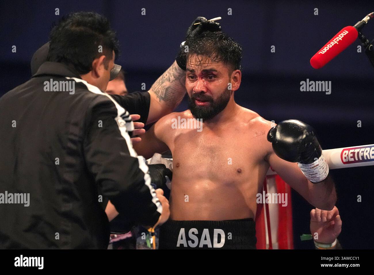 Asad Comp Asad Asif Khan following the end of a round against Josh Warrington ...
