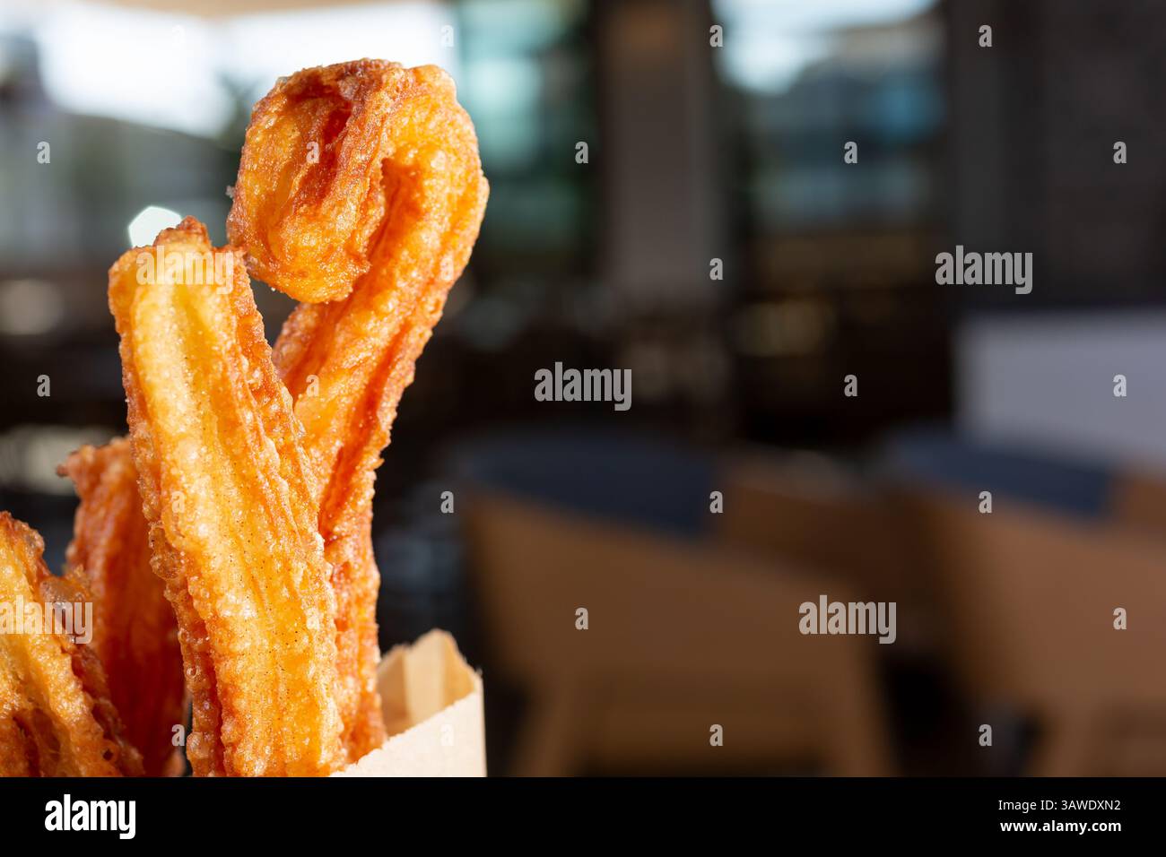 A closeup view of an order of churros, on the left side of the frame. Stock Photo