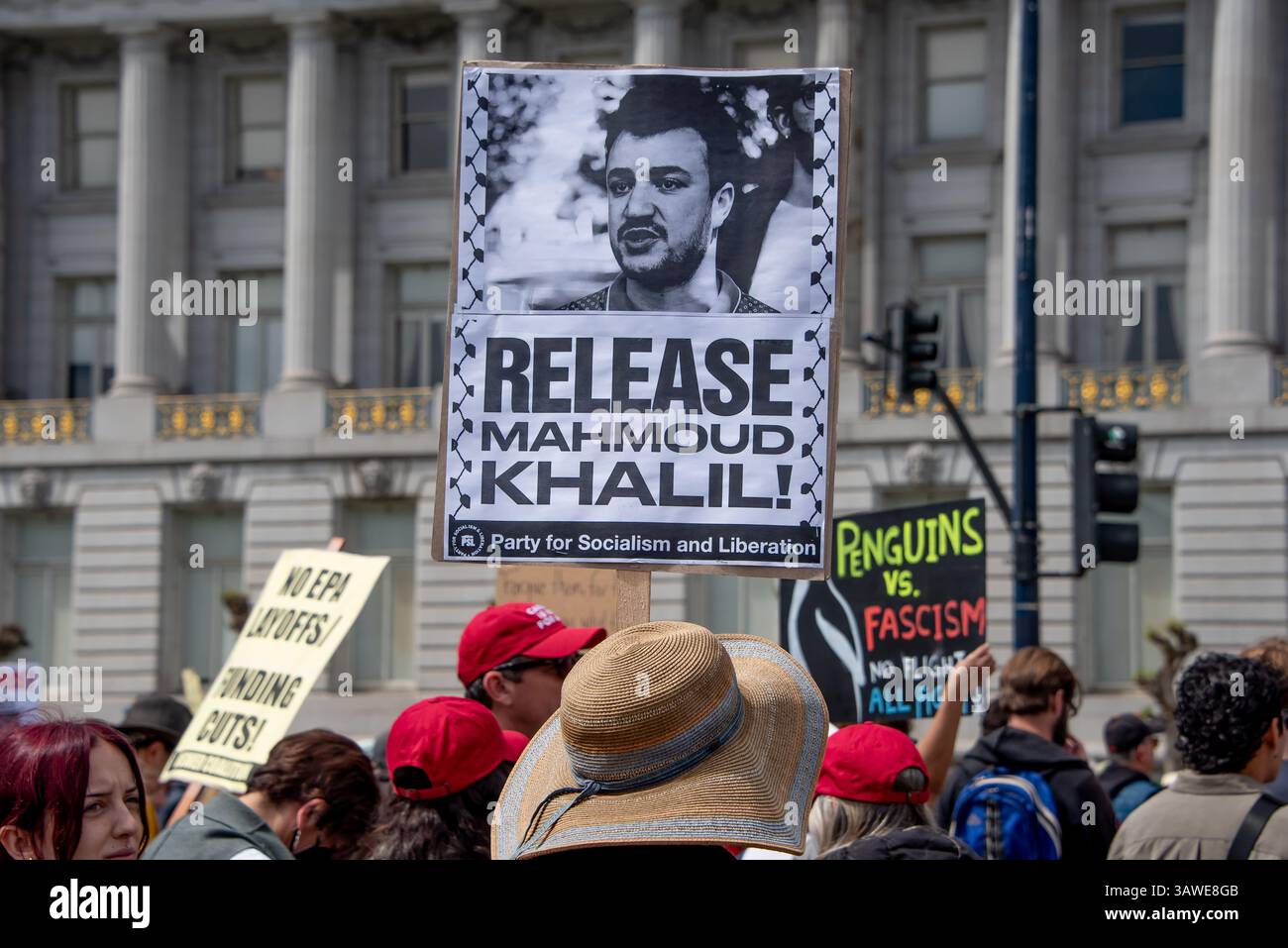 San Francisco, USA. 19th Apr 2025. A protester holds a sign high reading, 'Release Mahmoud Khalil!' at the Civic Center Plaza “Stop the Billionaire Agenda” protest against the Trump Administration. Credit: Shelly Rivoli/Alamy Live News - Stock Image
