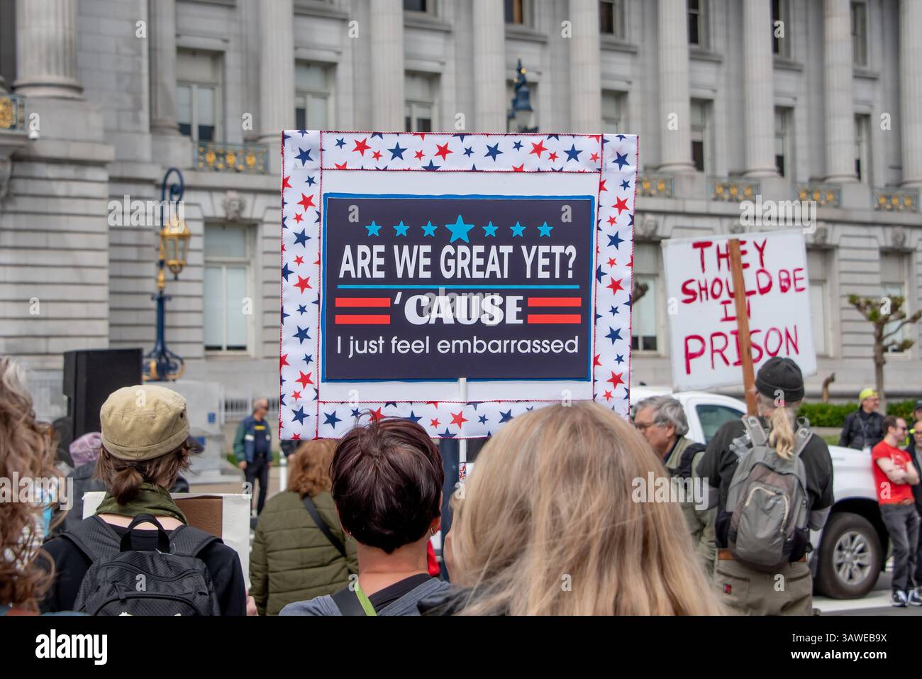 San Francisco, USA. 19th Apr 2025. At the Civic Center Plaza “Stop the Billionaire Agenda” protest against the Trump Administration, a protester holds a sign reading 'Are we great yet? 'Cause I just feel embarrassed.' Credit: Shelly Rivoli/Alamy Live News - Stock Image