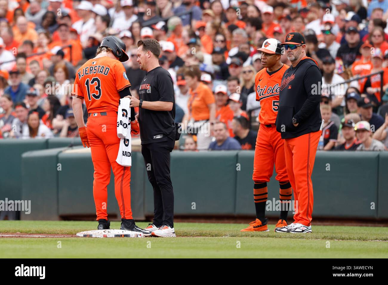 Baltimore Orioles' Heston Kjerstad (13) is evaluated by an athletic ...