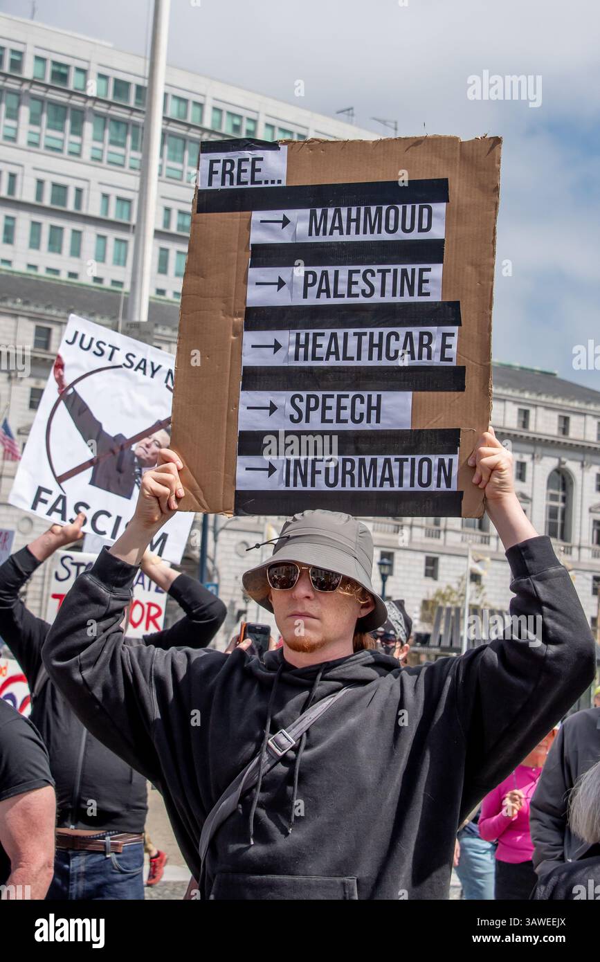 San Francisco, USA. 19th Apr 2025. At the Civic Center Plaza “Stop the Billionaire Agenda” protest against the Trump Administration, a young man holds a sign reading, 'Free... Mahmoud, Palestine, healthcare, speech, information.' Credit: Shelly Rivoli/Alamy Live News - Stock Image