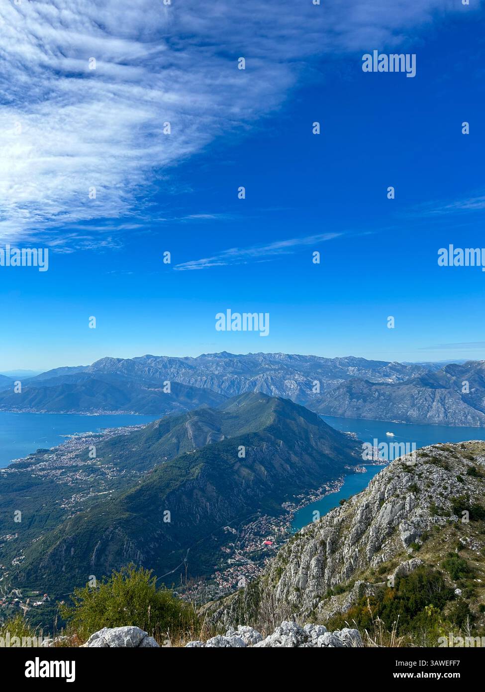 Majestic Bay of Kotor stretching below Lovćen, offering a breathtaking panoramic view. - Smartphone Captured Stock Image