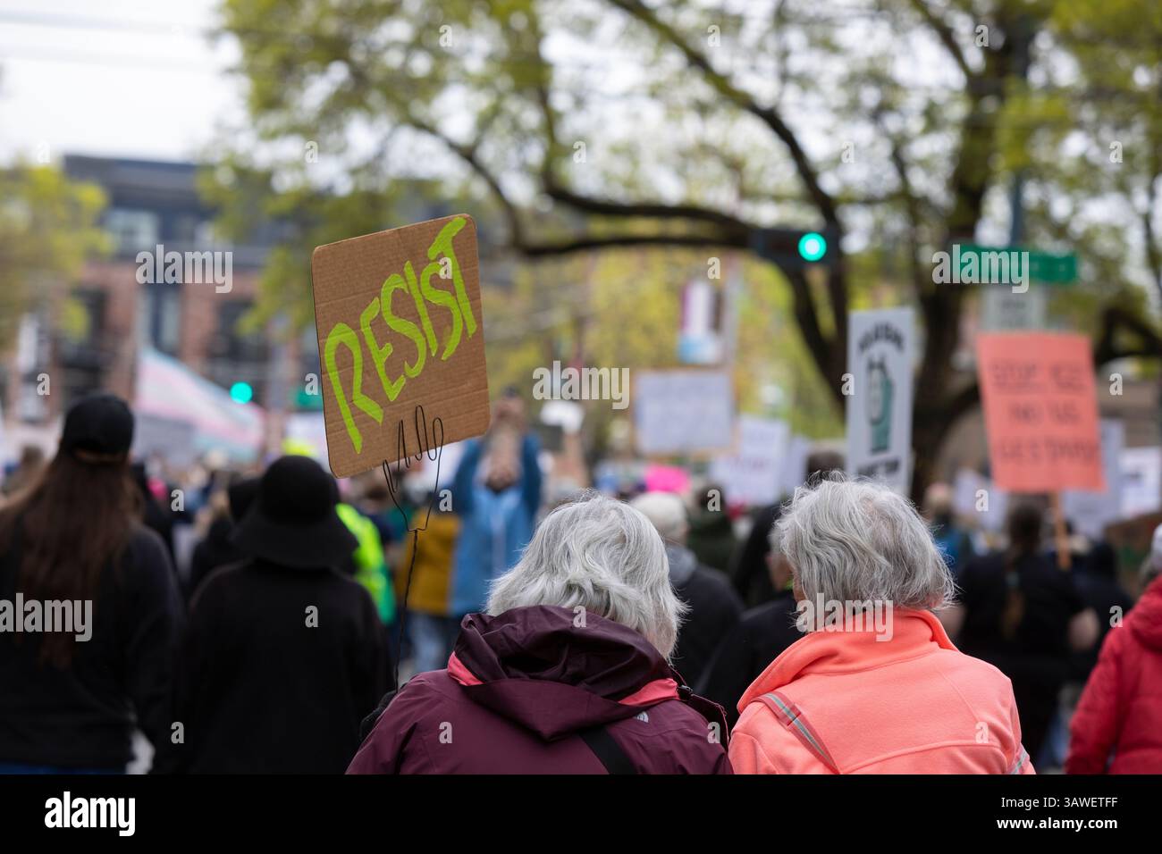 Seattle, Washington, USA. 19th April 2025. Hundreds of protesters and supporters march along Broadway Ave in Seattle’s Capitol Hill neighborhood during the 'We the People Means Everyone' rally and march in Seattle on Saturday, April 19, 2025. The demonstration in support of democracy, diversity and equity is part of a national day of action against actions of the Trump administration. Credit: Paul Christian Gordon/Alamy Live News Stock Photo