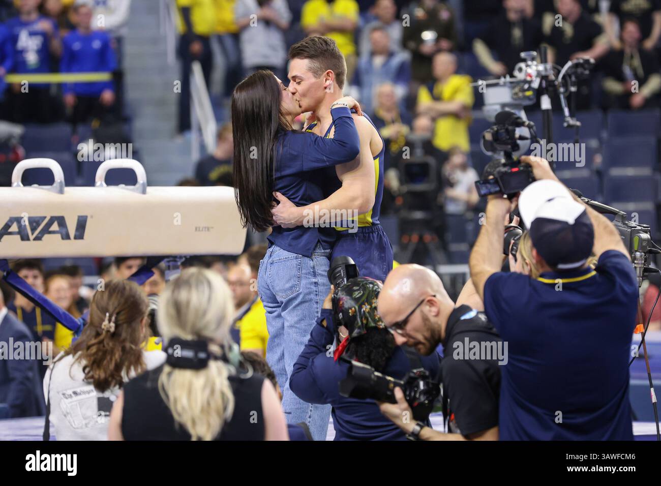 ANN ARBOR, MI APRIL 19 Michigan gymnast Paul Juda, right, kisses his