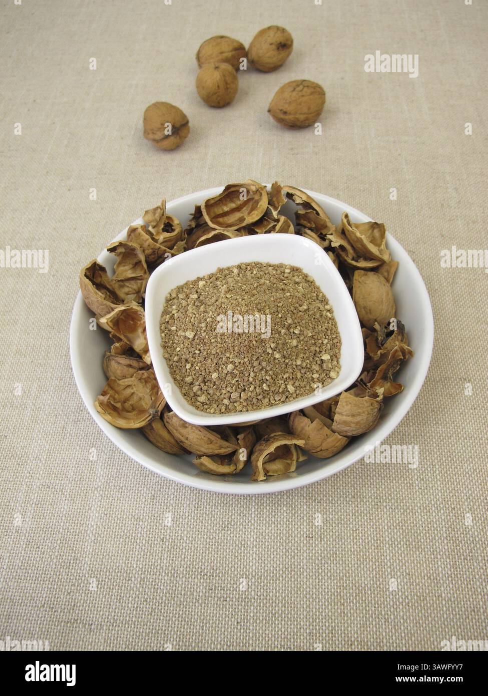 Brown granules of walnut shells, ground nutshells Stock Photo - Alamy